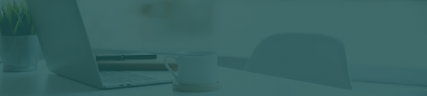 modern-workplace-with-laptop-computer-coffee-cup-and-office-supplies 1